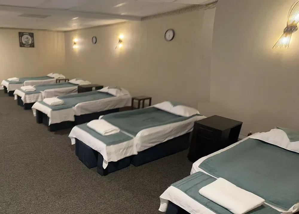 A group massage room with side-by-side tables at LuLu Pure Massage