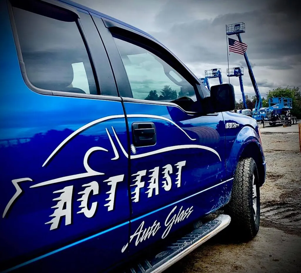 The blue Act Fast Auto Glass service truck