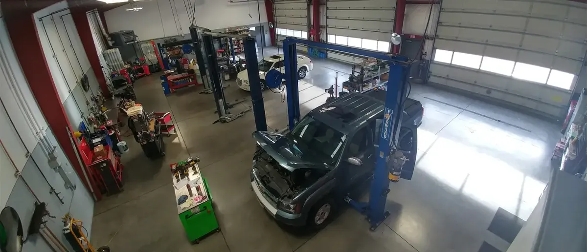 Inside the Car Kare shop in Bend with cars on lifts