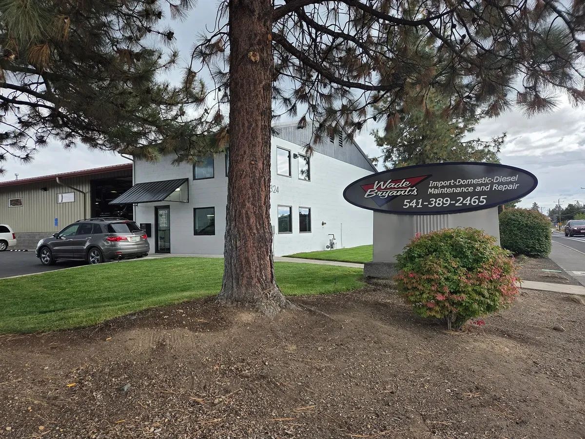 Wade Bryant's Auto Repair shop on SE 9th St in Bend under a big pine