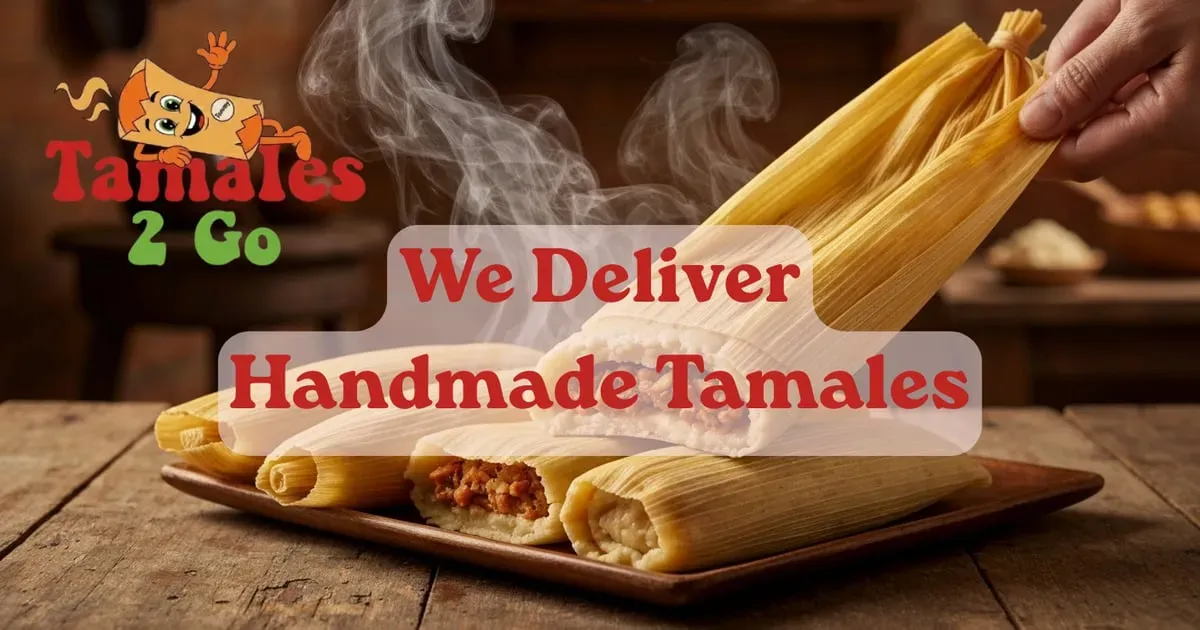 Hands unwrapping a fresh tamale from its corn husk