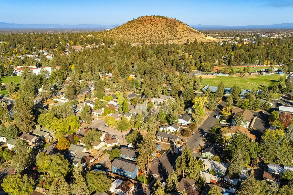 Aerial view of Bend neighborhoods around Pilot Butte with the high desert beyond