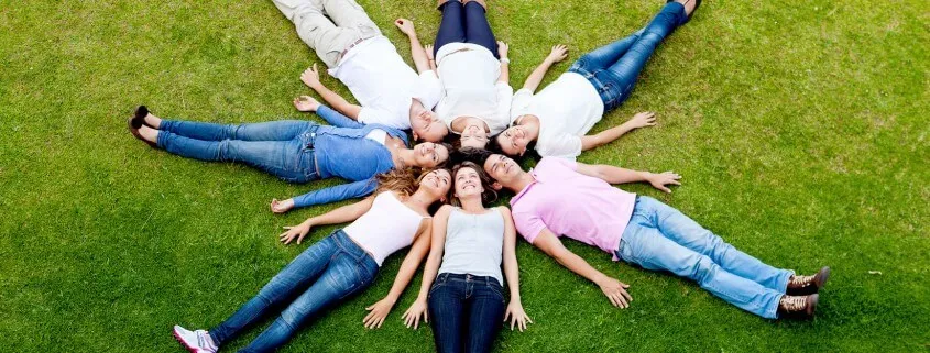 Neighbors relaxing on a lawn, from HOA Management, Inc.