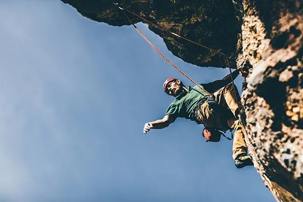 A climber on a rock wall, from Mile High Management