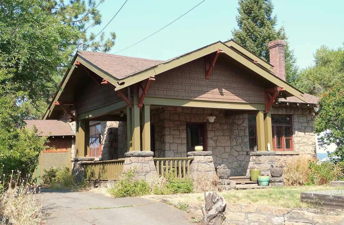 A Bend craftsman bungalow with shingle siding, lava-rock porch piers and ponderosa pines
