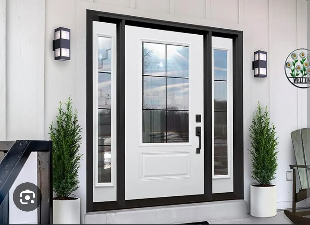 New white entry door with sidelights installed by Auxilium Construction Services in Bend
