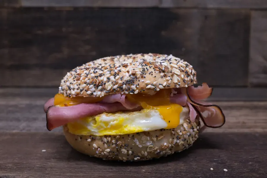 An everything bagel breakfast sandwich with ham and egg at Big O Bagels in Bend