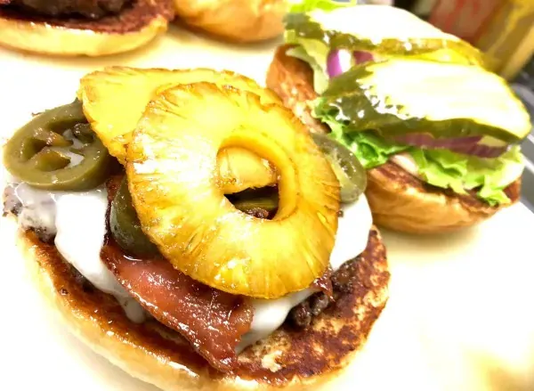 A burger topped with grilled pineapple and jalapeños at Bogey’s Burgers in Bend