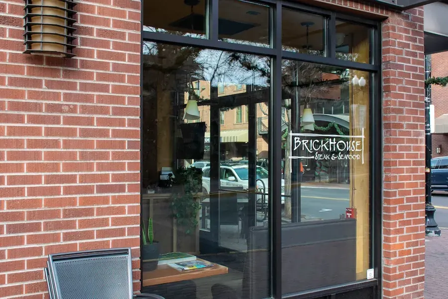 The brick storefront and front windows of Brickhouse steakhouse in downtown Bend