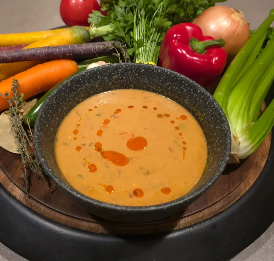 A bowl of tomato soup with fresh vegetables at Central Oregon Soup Company in Bend