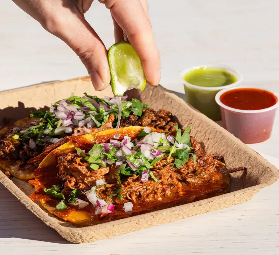 Birria tacos with salsas and a squeeze of lime from El Taquero in Bend