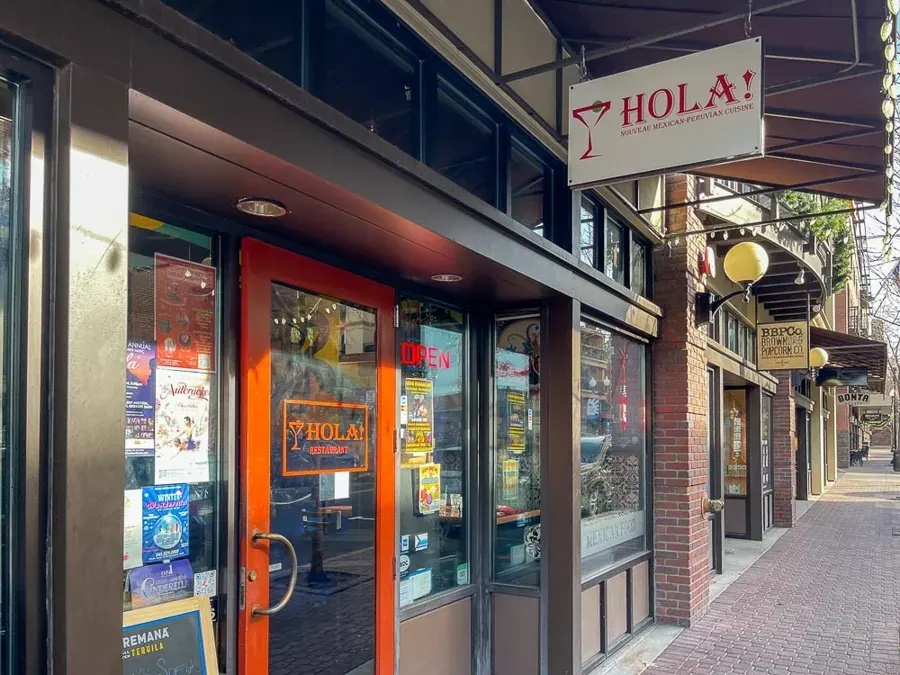 The Hola! storefront and sign on Bond Street in downtown Bend