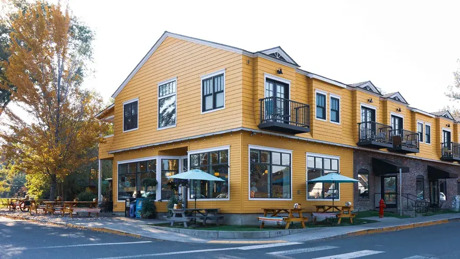The yellow corner building that houses Jackson’s Corner in Old Bend