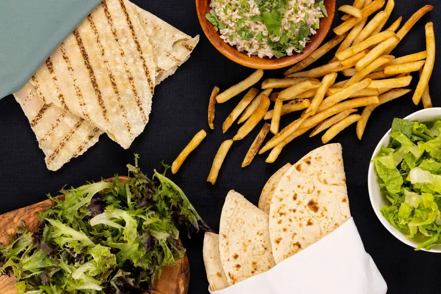 Pita, fries, salad and tabbouleh at Kefi Fast Fresh Mediterranean in Bend