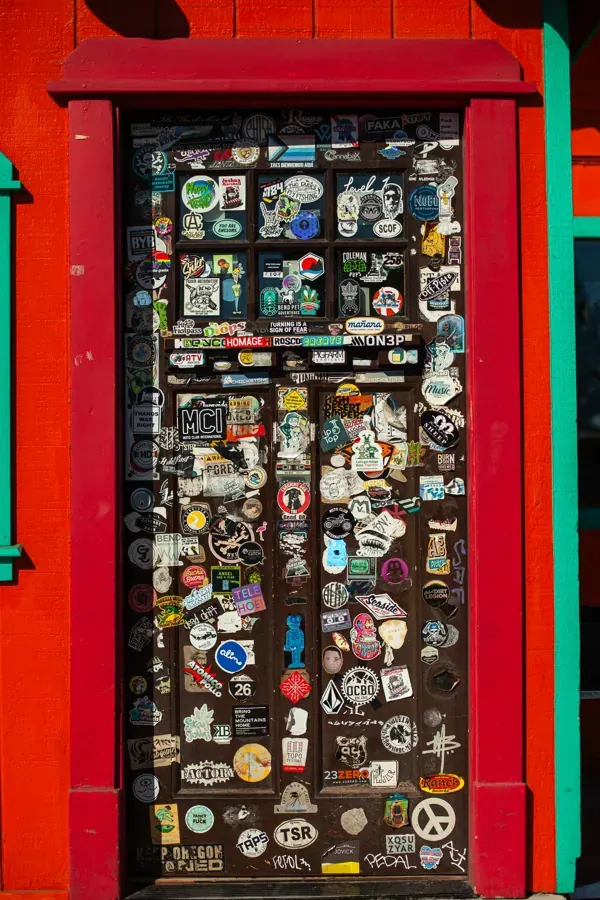 The sticker-covered red door at Parrilla Grill on the westside of Bend