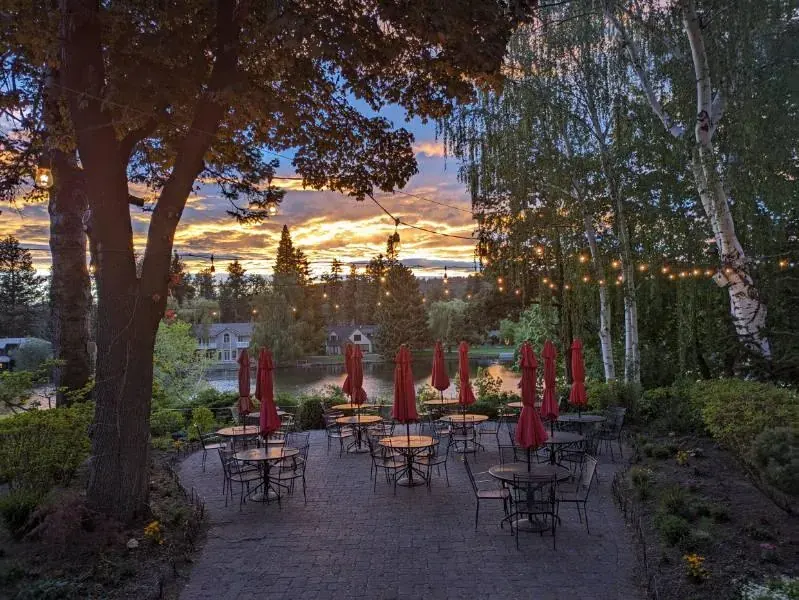 The garden patio at Pine Tavern above Mirror Pond in downtown Bend at sunset