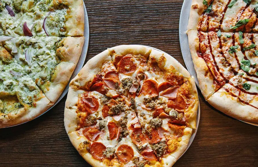 Three New York-style pizzas at Pinky G’s Pizzeria