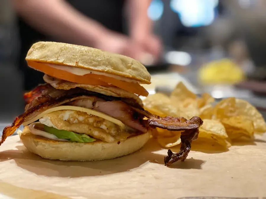 A hot sandwich with bacon and chips at Planker Sandwiches in downtown Bend