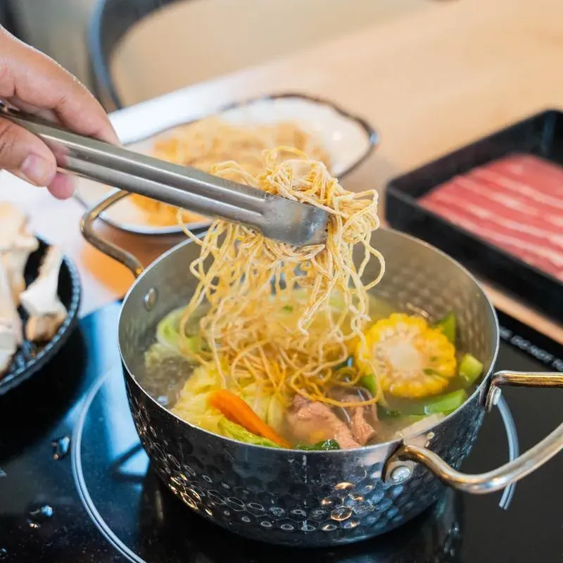 Noodles lifted from a hot pot at Sen Thai Noodles & Hot Pot in Bend