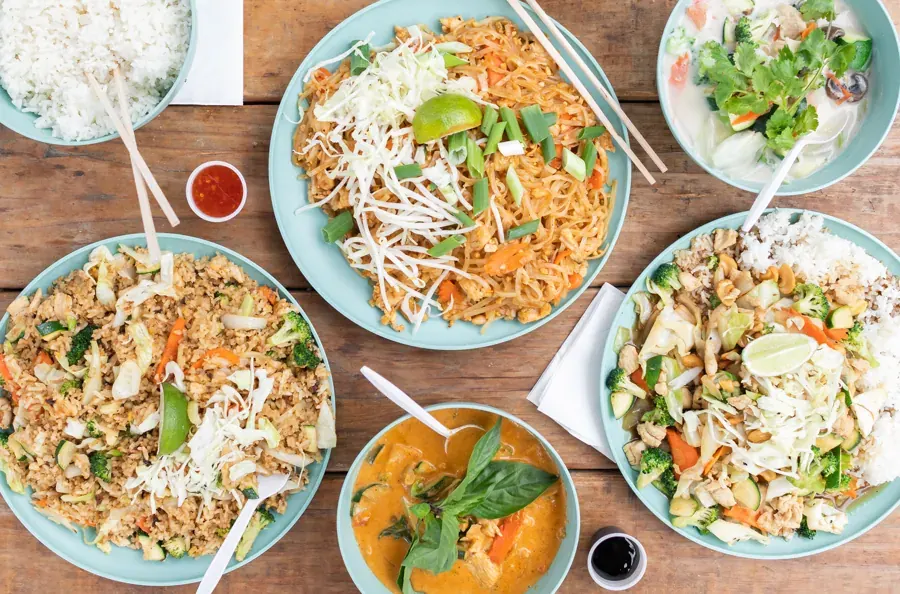 A spread of Thailandia noodle and curry dishes