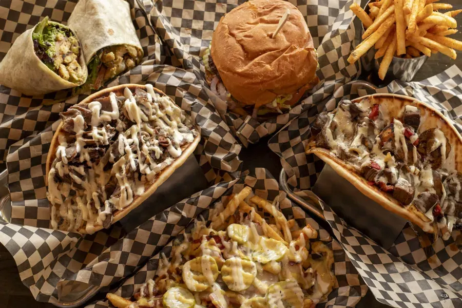 Burgers, wraps and fries in checkered baskets at That Guy’s Bistro in Bend