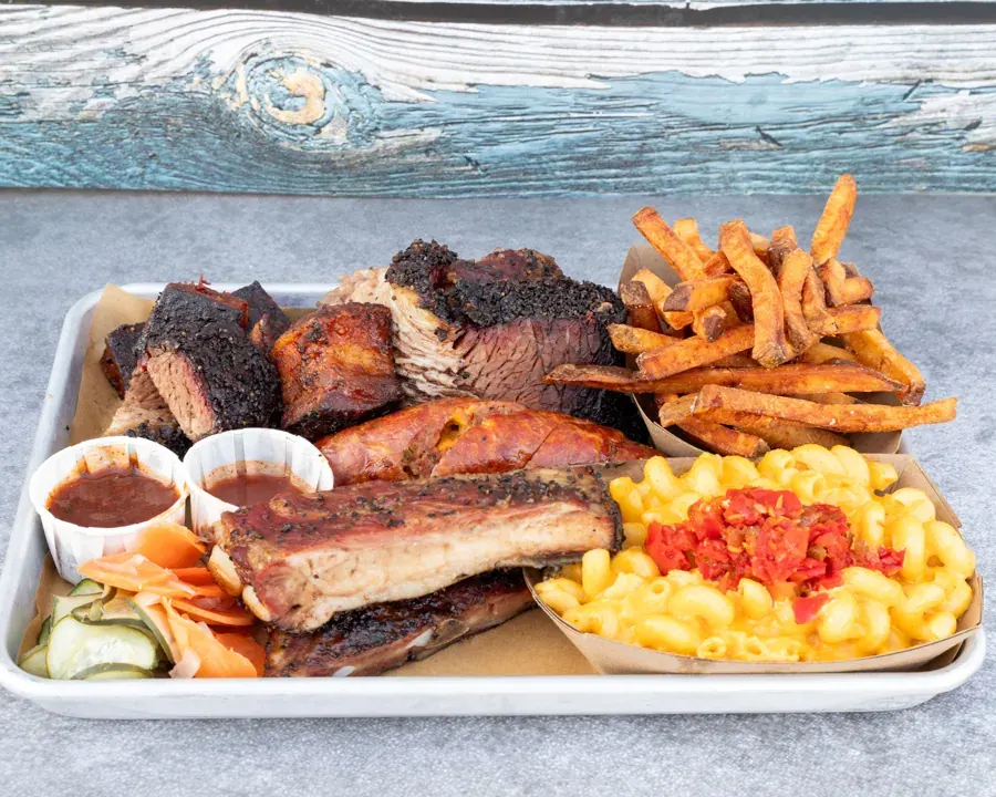A tray of brisket, ribs, mac and cheese and fries from Hattie’s BBQ at The Cross-Eyed Cricket in Bend