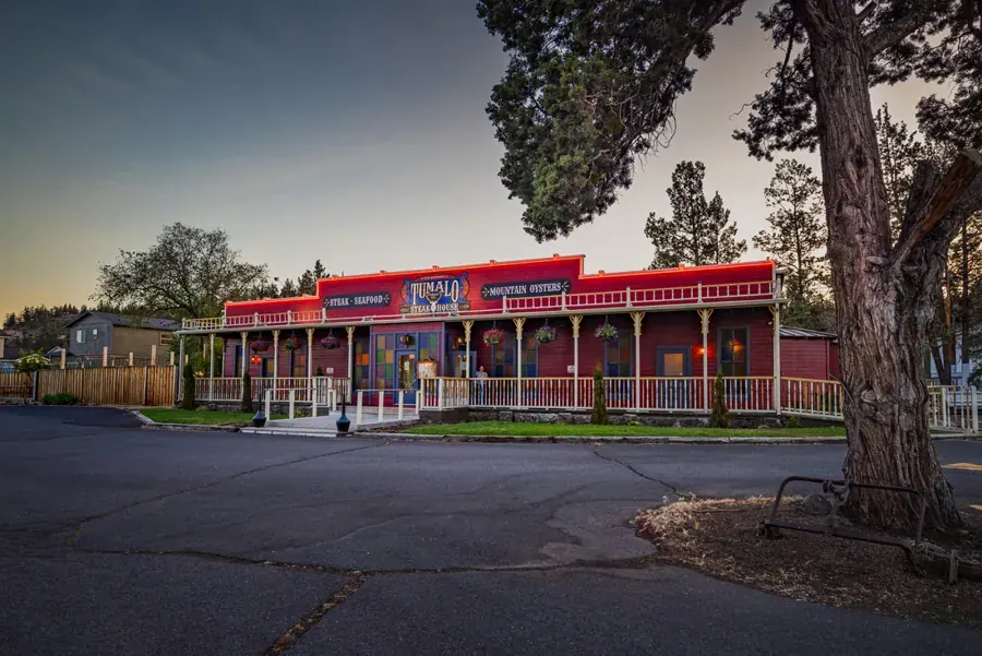 The red Western storefront of Tumalo Feed Co. Steakhouse in Tumalo, Oregon