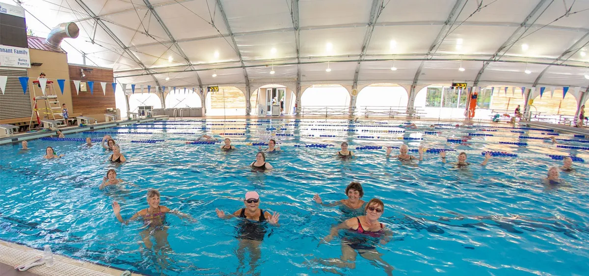 Lap swimmers in the indoor pool at Juniper Swim & Fitness Center