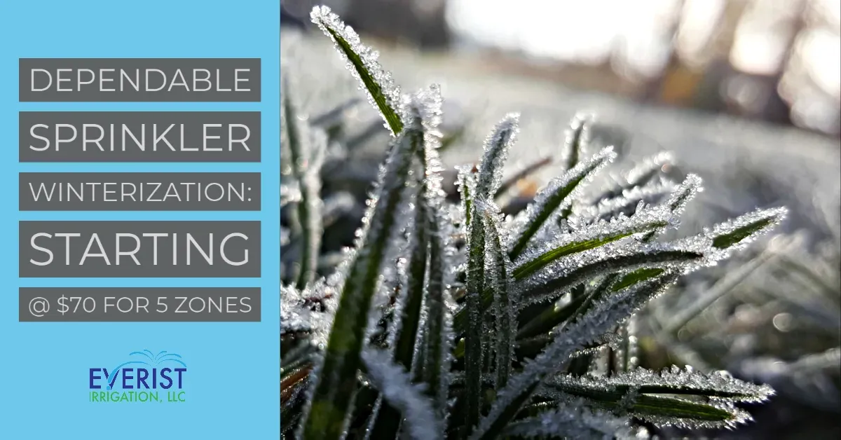 Frost on grass next to an Everist Irrigation winterization sign