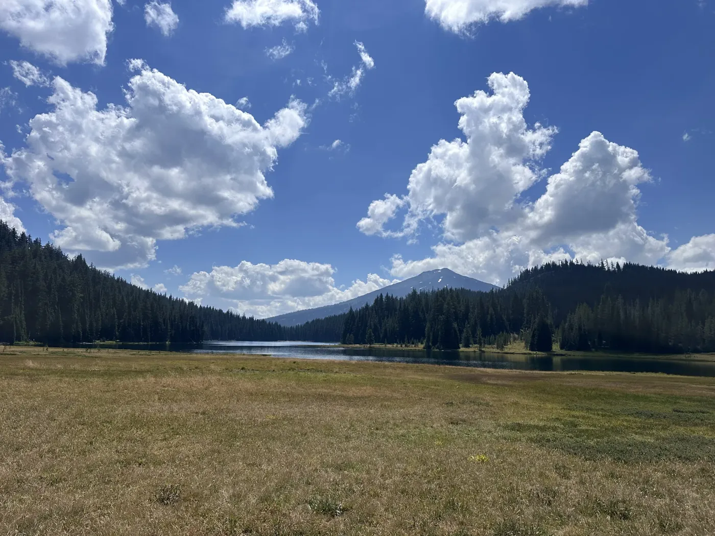 A mountain lake below a snowy Cascade peak along the Cascade Lakes Highway