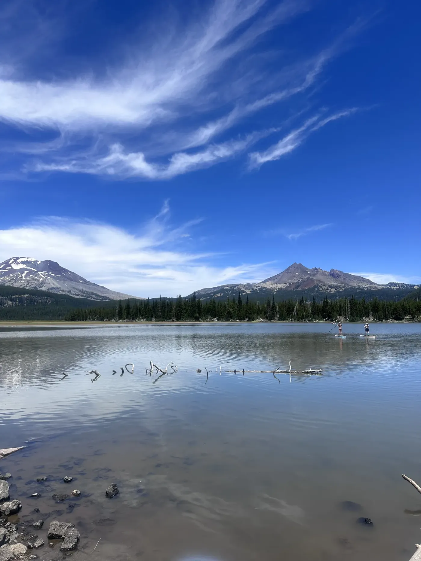South Sister reflected in a calm Cascade lake on a blue-sky morning
