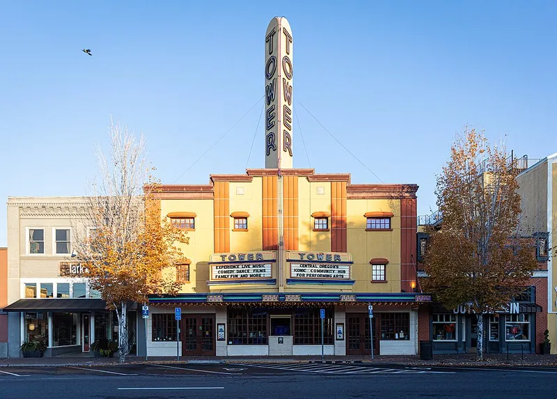 The Tower Theatre on Wall Street in downtown Bend with fall trees